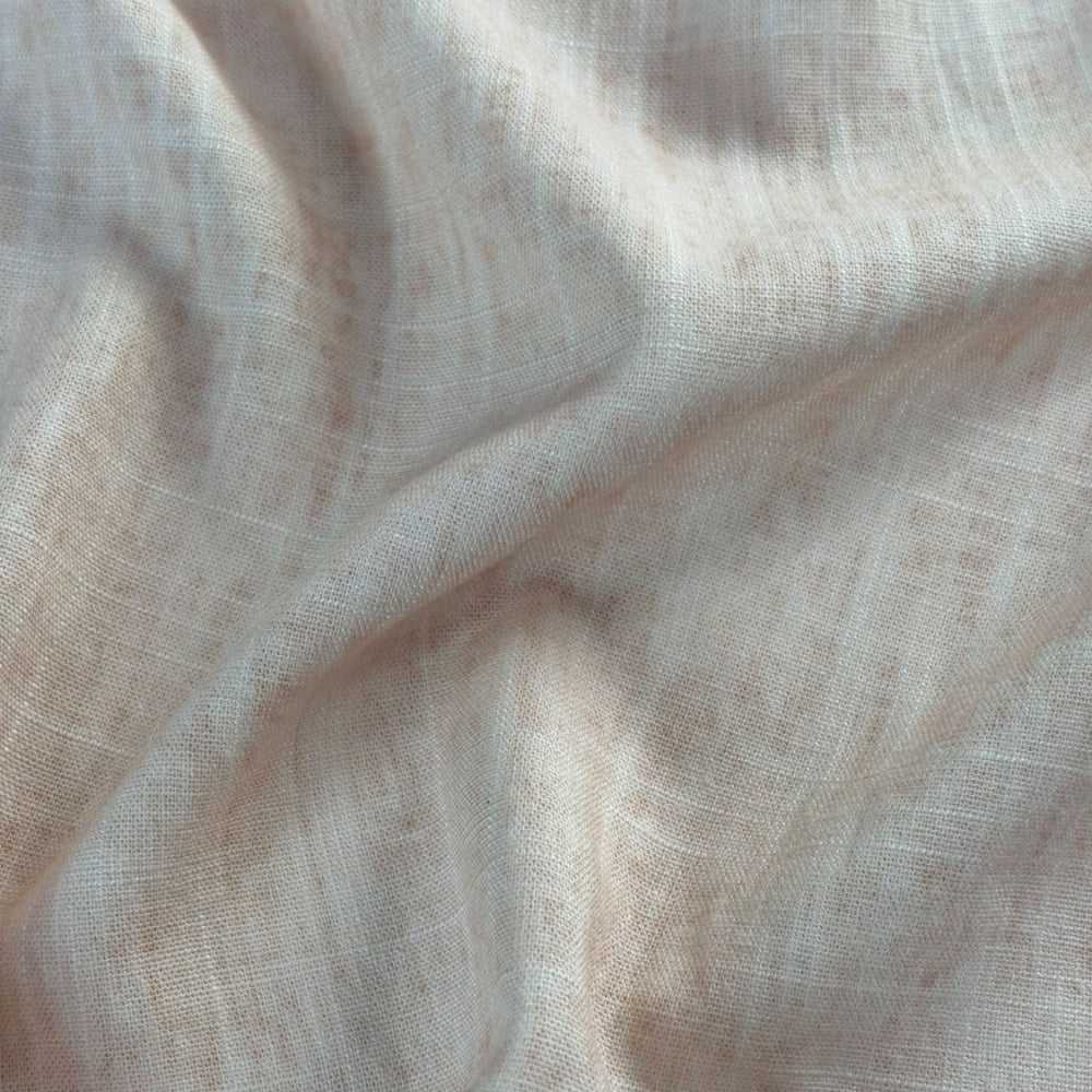 Close view of plain off-white fabric with a fine, open woven grid, gathered into broad diagonal folds.