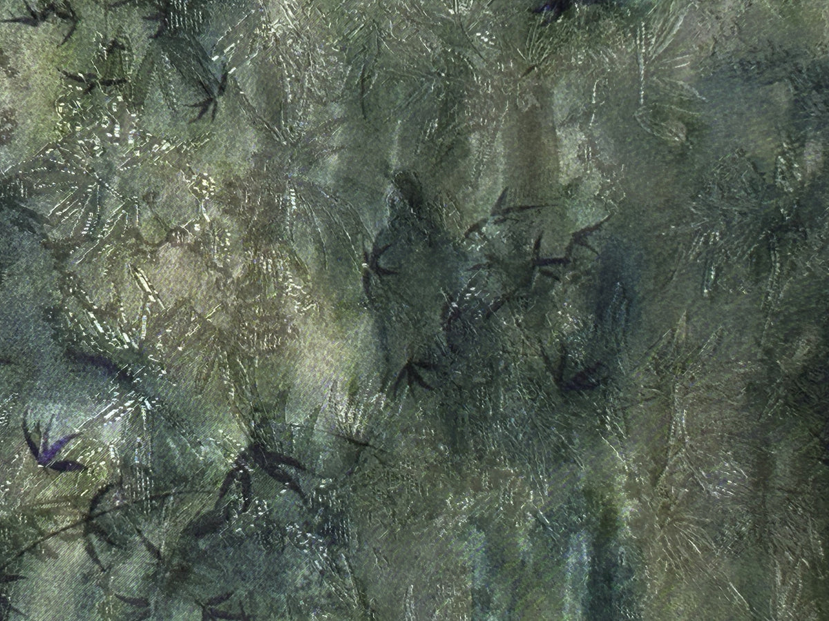 Close-up of a dark green and gray textile with an irregular mottled pattern and scattered fine, pale scratch-like lines.