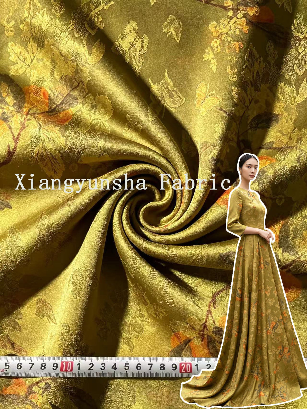 Close-up of olive-gold fabric gathered into a spiral, with a woven floral and butterfly motif in gold and muted orange. A ruler runs along the bottom edge, and a cutout view of a matching long dress appears at the right.