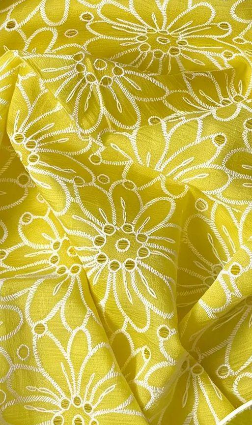 A bold floral pattern on a yellow ground, seen close